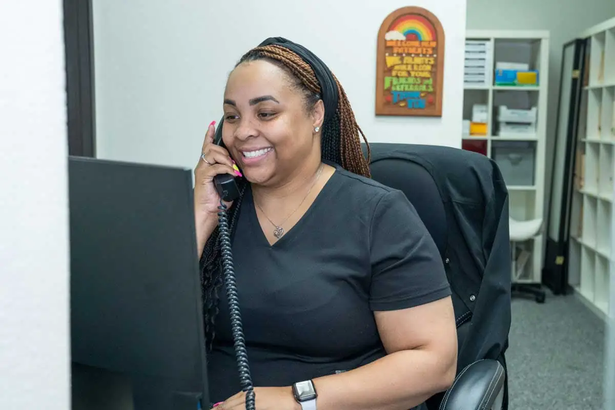 front desk coordinator at Smile Time Dentistry scheduling an emergency appointment for a patient