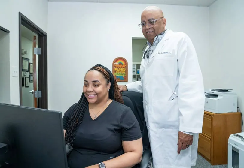 DeSoto dentist Dr. Daniels and his treatment coordinator at Smile Time Dentistry